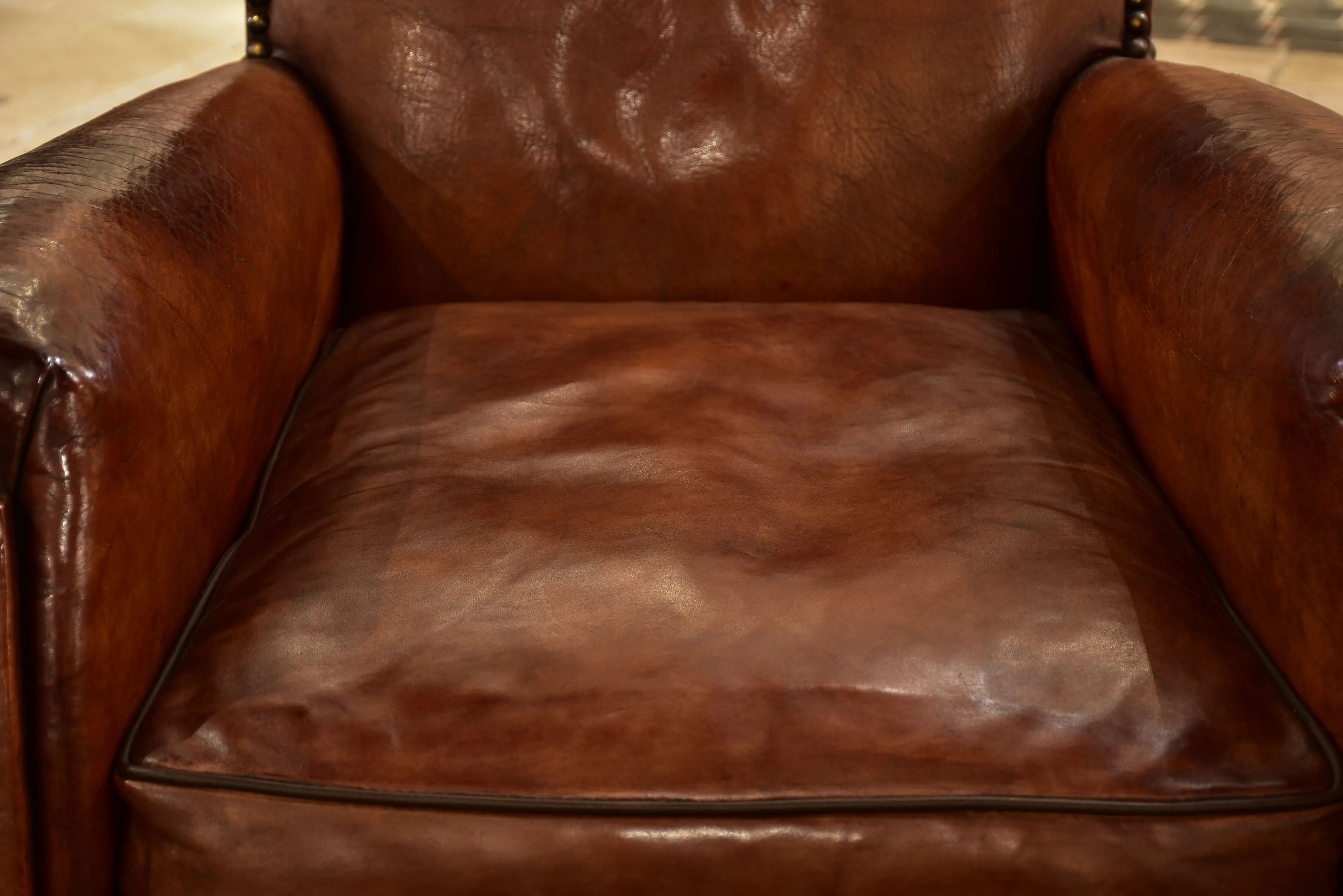 Pair of French leather club chairs from the 1930's with stud detail