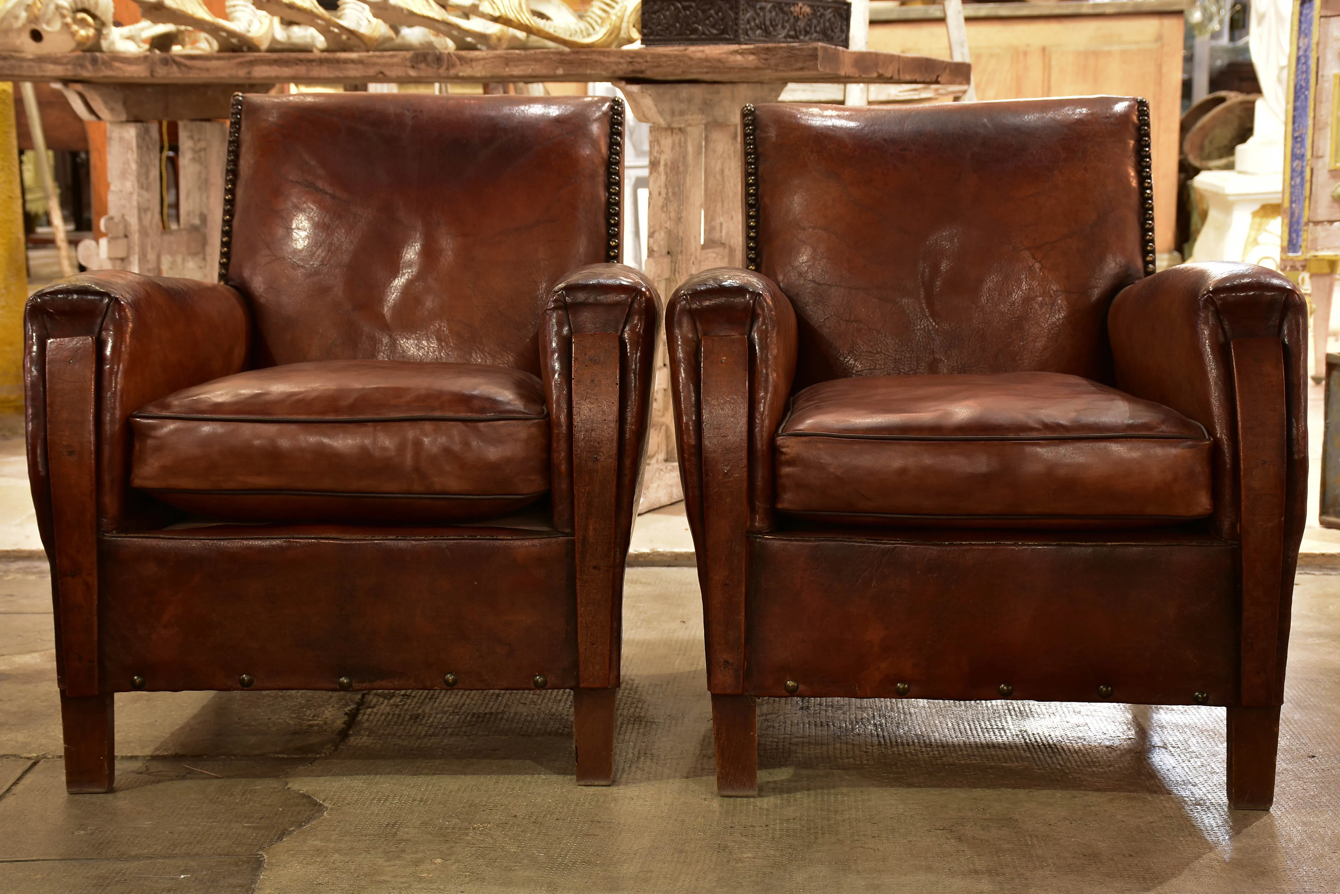 Pair of French leather club chairs from the 1930's with stud detail