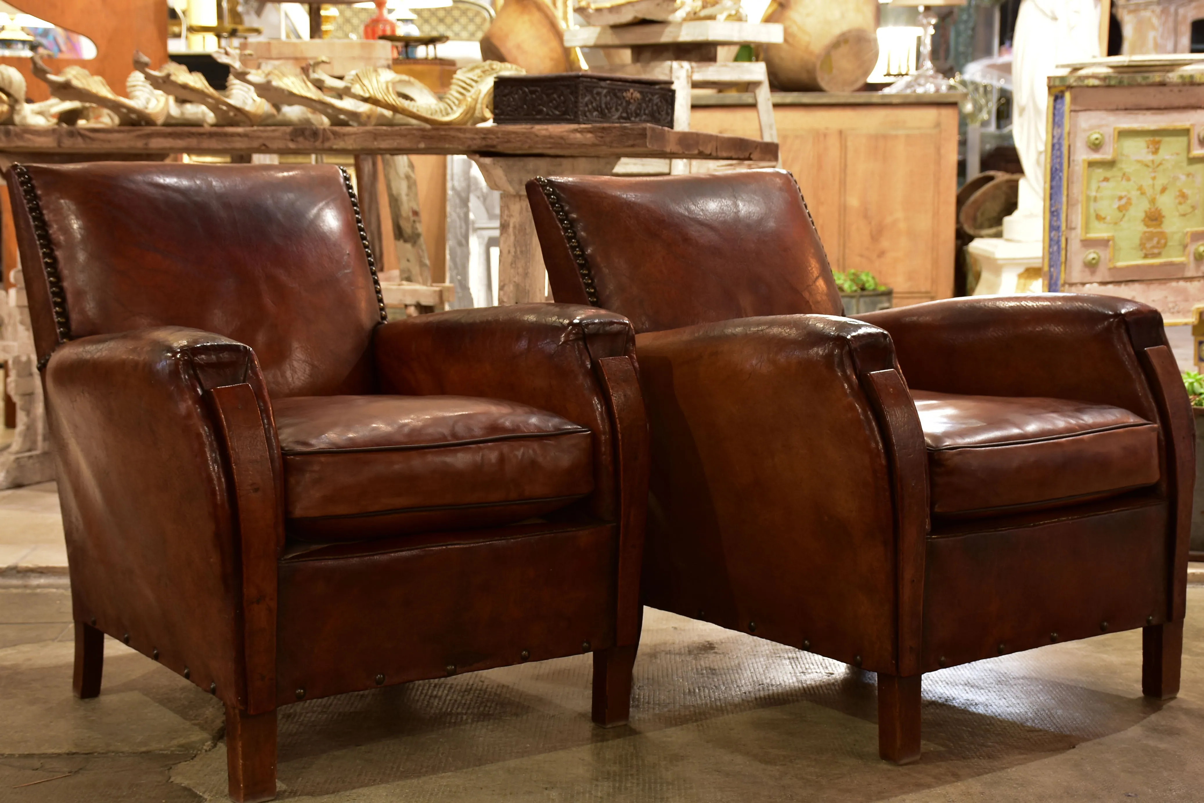 Pair of French leather club chairs from the 1930's with stud detail