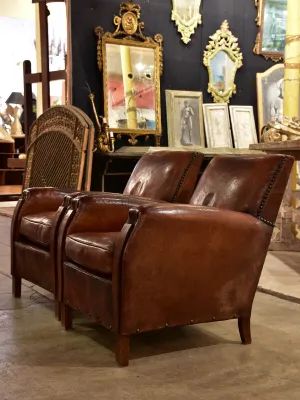 Pair of French leather club chairs from the 1930's with stud detail