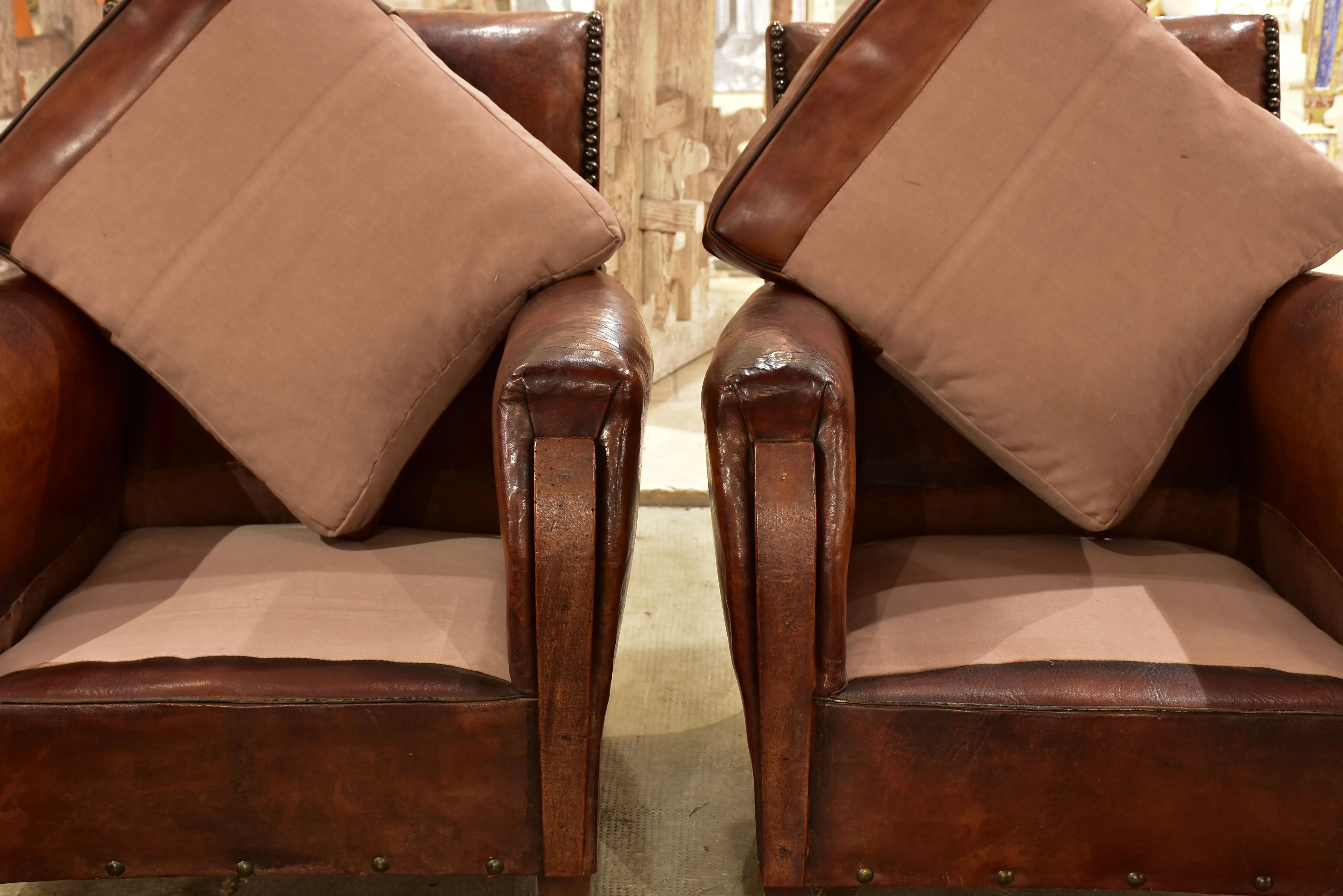 Pair of French leather club chairs from the 1930's with stud detail