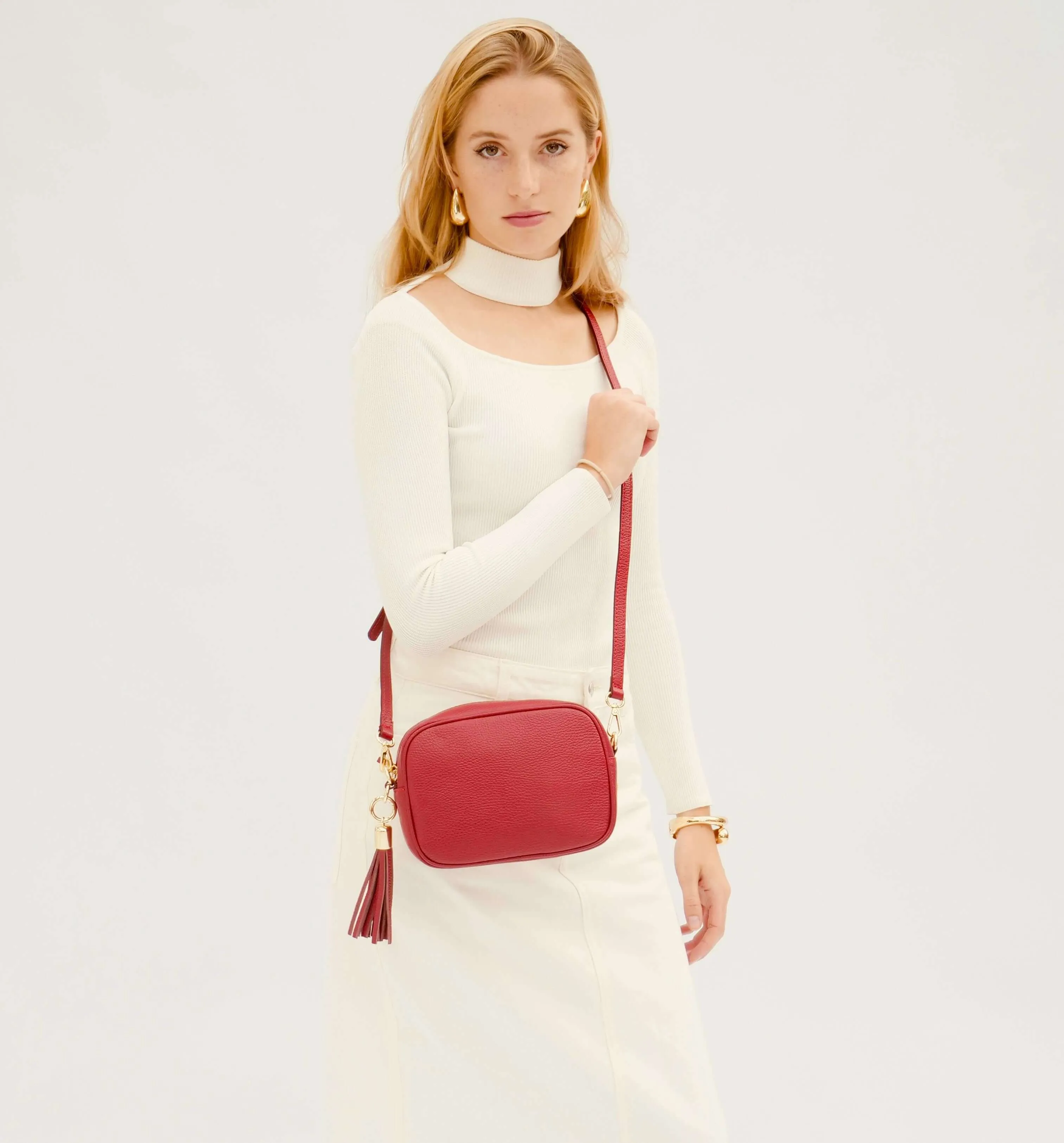 The Tassel Cherry Red Leather Crossbody Bag With Red Cross-Stitch Strap